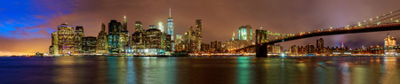 Skyline of downtown New York, New York, USA Night view of the Brooklyn Bridge in New York Cityの写真素材