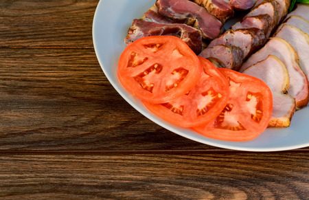 Assorted deli meats - ham, sausage, salami, parma, prosciutto, baconの写真素材