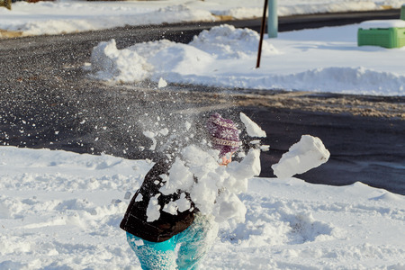 little girl playing with snow outdoors cute little girl is going skate outdoors