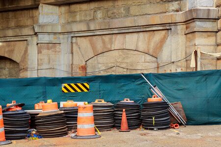 Construction zone with orange caution markers along an urban street. road worksの写真素材