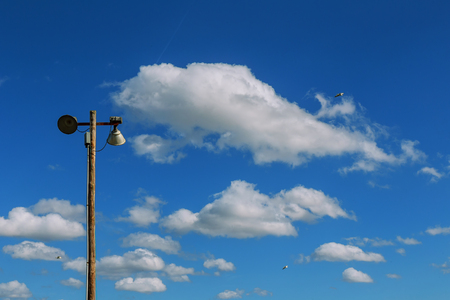 Street Light Against Blue Sky and White Clouds bedside lamp against the sky cloudsの写真素材