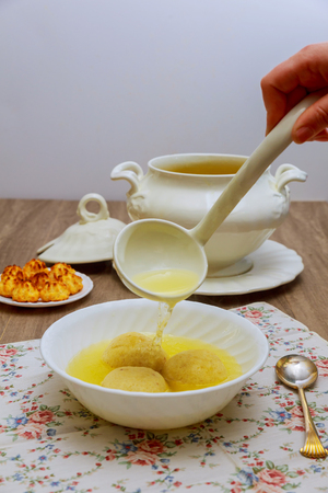 Matzo Matzah balls in a bowl of soup homemade healthy israelilの写真素材