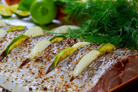 marinated fish with lemon and onion dish in the oven
