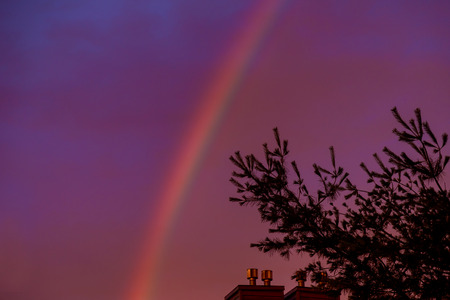 Rainbow in the sky during the sunsetの写真素材