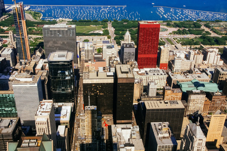 CHICAGO, USA - 20 July, 2017: A view on a day with Clouds rolling over Chicago city downtown Skyline with aerial view of buildings covered partially with cloudsのeditorial素材