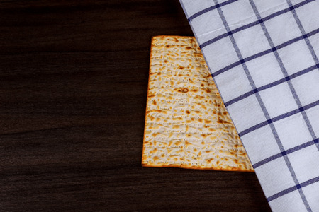 Matzoh for jewish holiday Passover pesah on wooden background. View from aboveの写真素材