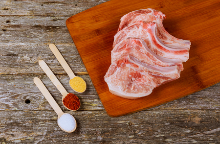 pork steak on a wooden board Pork chops on a cutting board. Selective focusの写真素材