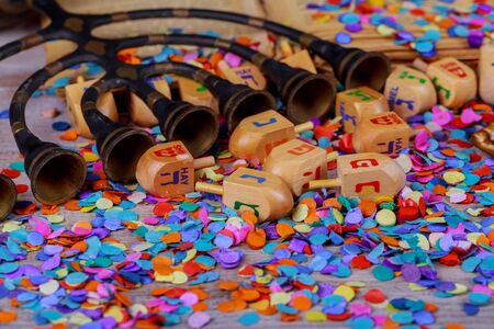 Jewish holiday Hanukkah menorah with of Hanukkah dreidels in rustic setting Chanukah wooden dreidels on a wood surface.の写真素材