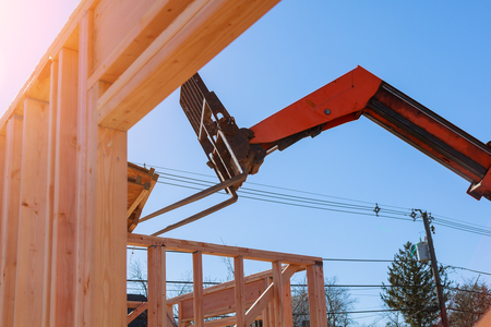 New residential building under construction with the crane about. Low rise wood frame buildingの写真素材