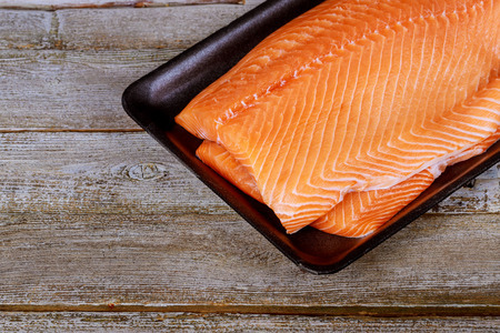 Salmon Fish..Raw salmon fillet on wooden table