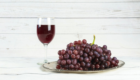 glass of wine and grapes, isolated on white wine grapesの写真素材