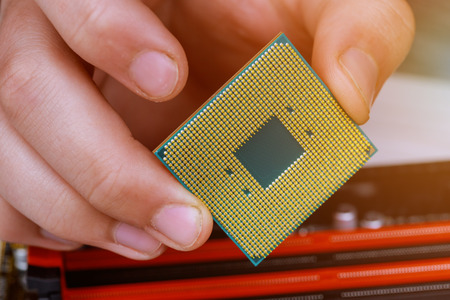 Engineer Technician plug in computer CPU microprocessor to motherboard socket. technology background...