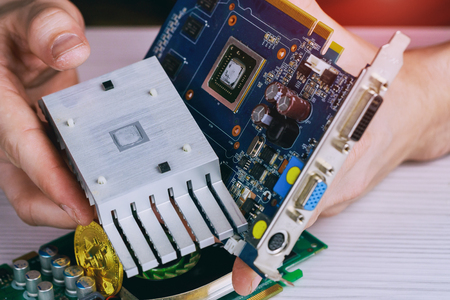 Mining crypto currency. Close-up and selective focus a graphic card of computer working for bitcoin...