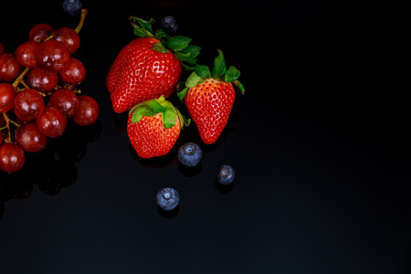 Set of fresh fruits and berries. Ripe blueberries, raspberries .Various fresh summer berries on white background blueberries grapes and strawberries blackerries and fruitsの写真素材