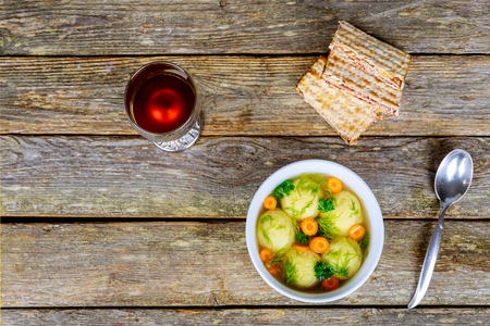 Homemade Matzo Ball Dumplings with Parsley for passover and Delicious Matzoh ball soup with crackers wine and dillの写真素材