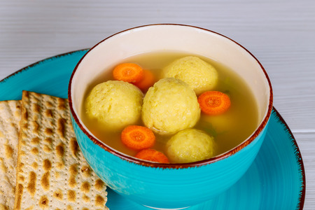 Traditional Jewish Matzah balls in a pot of soup during the Jewish holiday of Passover Pesach. matzah, Jewish symbolsの写真素材