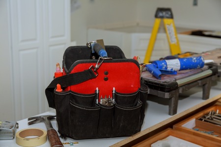 set of tools in a bag on wooden background, Close up of tools on a toolの写真素材