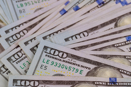 US dollar cash banknote money one hundred US dollar bills on a table