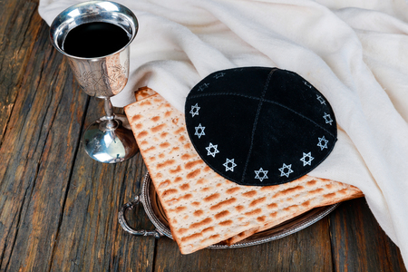 Jewish Matzah on Decorated Silver wine cup with matzah, Jewish symbols for the Passover Pesach holiday. Passover concept.の写真素材