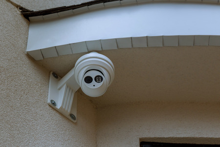 Outdoor CCTV monitoring, security on wall background for safety concept