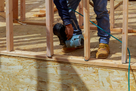 Framing building contractor framing authentic construction worker wall section for a luxury custom...