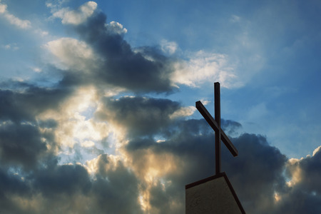 cross and church steeple at dusk silhouette with the as backgroundの写真素材