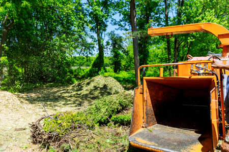 Bigmachine chipper blowing tree branches cutの写真素材