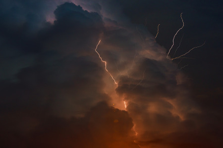 Multiple forks of pierce the night sky thunderstorm with lightning