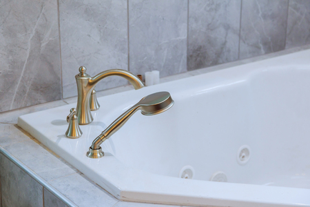 Freestanding bath with bath in white modern bathroomの写真素材