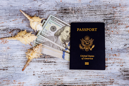 Dollar with US Passport and international currenciest and Money saving and travel holiday conceptの写真素材