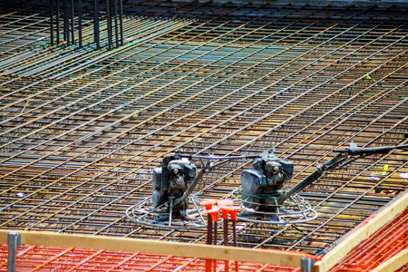 Closeup of Steel rebars. Geometric alignment of Rebars on construction site Reinforced steel rods...