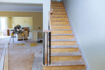 Walls of Interior construction of housing project with drywall installed and patched without...