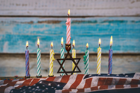 Colorful candles from a burning hanukkah candles in a menorahの写真素材