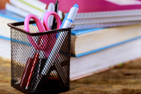 School supplies with books Pile of Books with Color Pencils, A wood Background.の写真素材