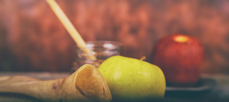 Shofar on a wood background - rosh hashanah Honey, apple and pomegranate traditional holiday symbols a kippah a yamolkaの写真素材