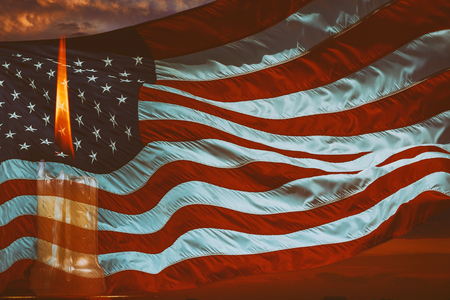 Candle light memory burning brightly in the American flag background