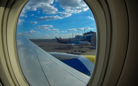 Airplane view in airport terminal. Loading cargo on plane in airport. cargo plane loading for...