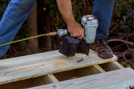 Close up of exterior timber decking building a backyard deck with composite deck boardsの写真素材