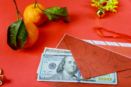 Chinese New Year background. Chinese good US dollars luck symbol isolated on redの写真素材