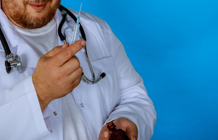 A nurse in the hospital is preparing in the injection a patient