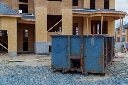 Dumpsters being full with garbage container trash on ecology and environmentの写真素材