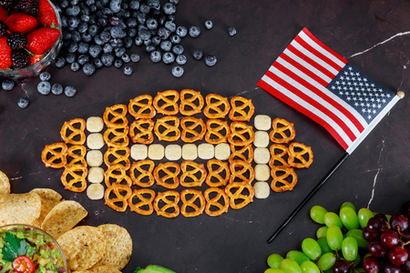 Snacks and with chips and salsa out for american super bowl watching party top viewの写真素材