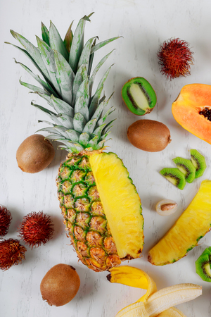 Assortment of tropical exotic fruits white background top view.の写真素材