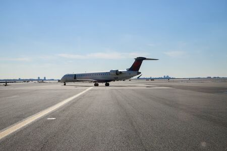 FEB 14, 2019 JFK NEW YORK, USA: Al DELTA aircraft at the John F. Kennedy International Airport plane taking off runway It is the international air passenger gateway in the United Statesのeditorial素材