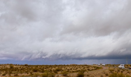 A highway runs along desert road to Arizona, USAの写真素材