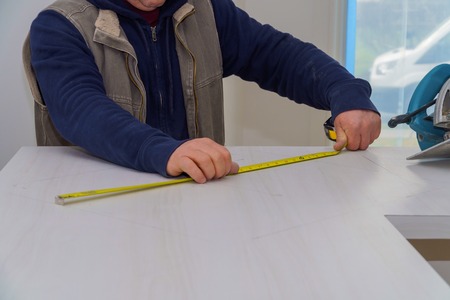 Laminate kitchen formica to cut counter top contractor using saw.の写真素材