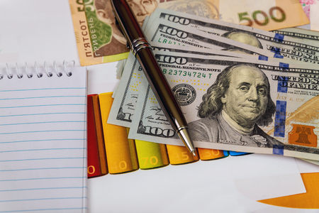 American and Ukrainian money US dollar and Ukrainian hryvnia exchange rateの写真素材