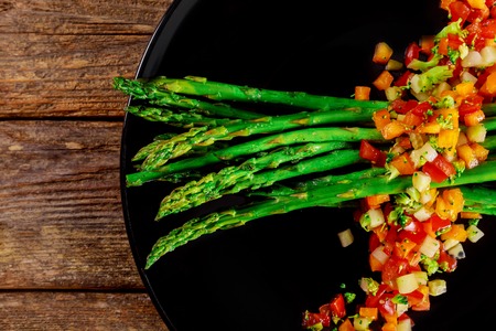Delicious green salad with asparagus and tomato crushedの写真素材