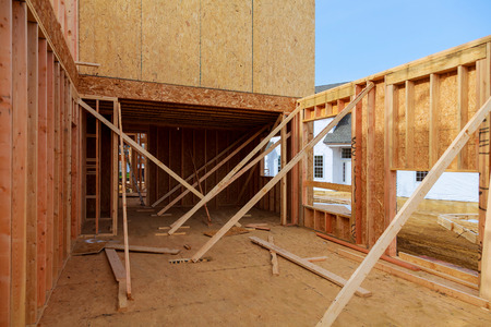 construction house framing wood of new residential home under construction.