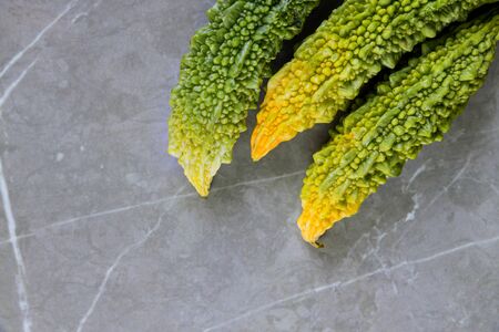 Bitter melon fresh organic green fruit or vegetable cultivated in the local farmers market Indian farm.の写真素材